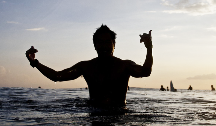 Person holding up a shaka