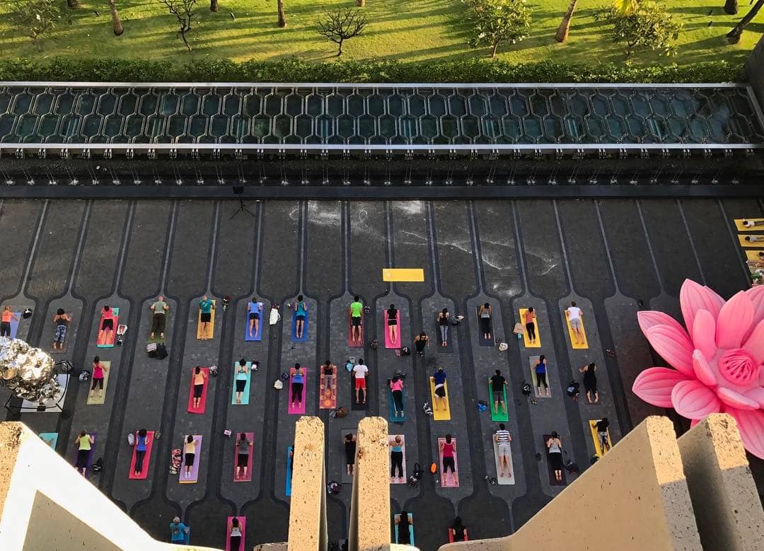 Courtyard yoga, #HonoluluBiennial style! Every Thursday, at 5:30pm! #WeAreWard | Artist: Choi Jeong Hwa, Breathing Flower | Artist: Zhan Wang, Artificial Rock No. 131