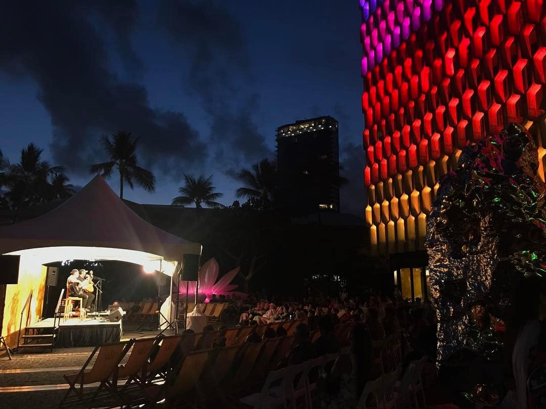 Celebrating Hawaiian culture tonight at Kona Nui Nights in the midst of @honolulubiennial art! | Artificial Rock No. 131 by Zhan Wang & Breathing Flower by Chou Jeong Hwa. #WeAreWard