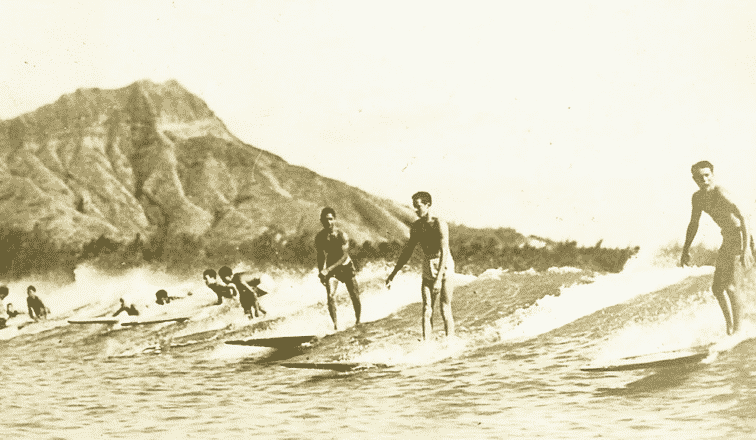 Surfing people with Diamond Head in the background