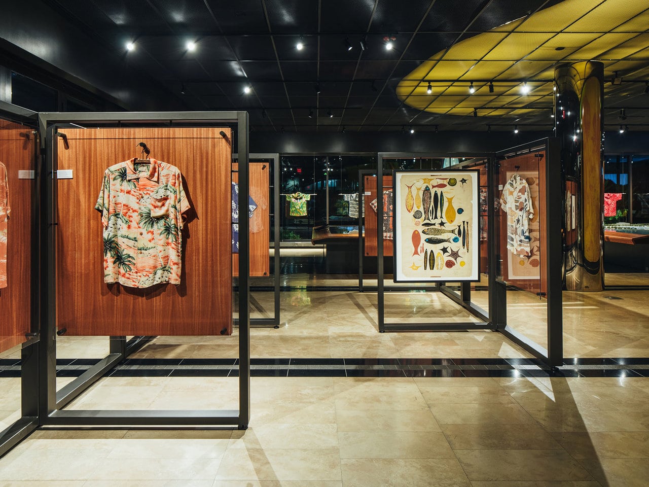 An exhibit of Aloha shirts and artistic prints
