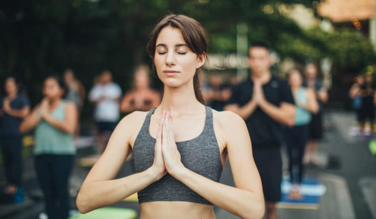 Woman with eyes closed at Yoga in the Courtyard