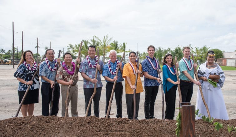 Ten people holding wooden shovels at Aalii Groundgreaking