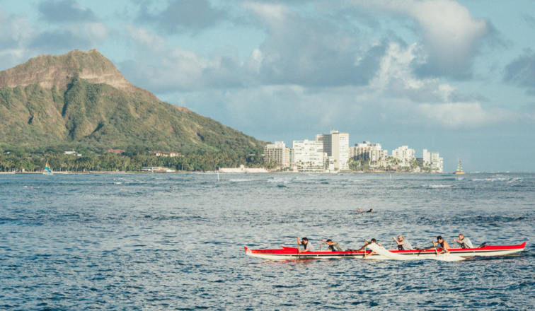 Team paddling an outrigger together