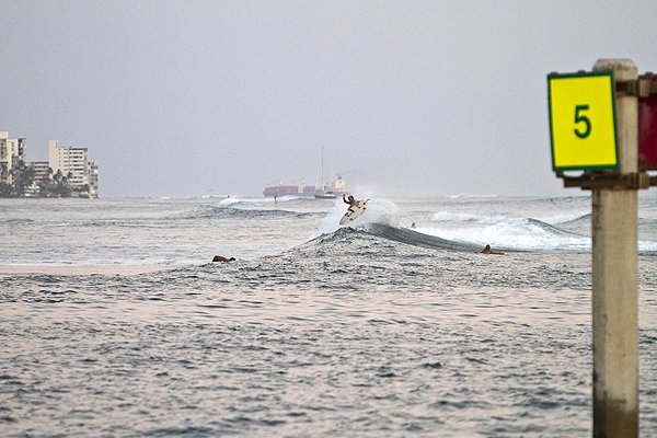 Person surfing on a wave at Ala Moana