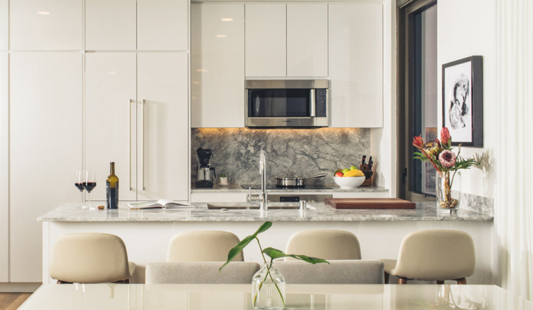 A dining table and kitchen counter