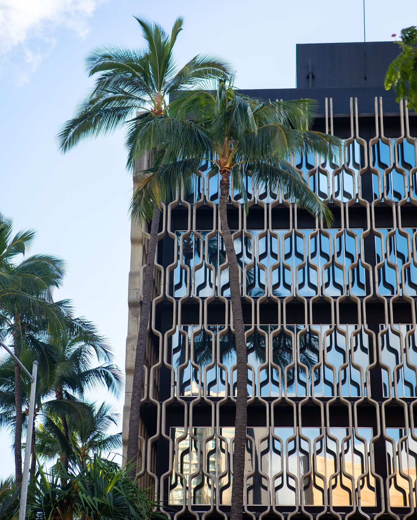 The IBM Building, which serves as Ward Village’s headquarters, opened in 1962 and was designed by famed architect Vladamir Ossipoff. He is Hawaii’s most renowned mid-century modern architect and has iconic projects throughout the state. Stay tuned throughout the year to see our building light up in different colors to represent various holidays and events!