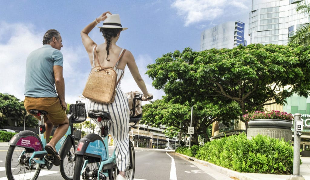 One man and woman riding Biki