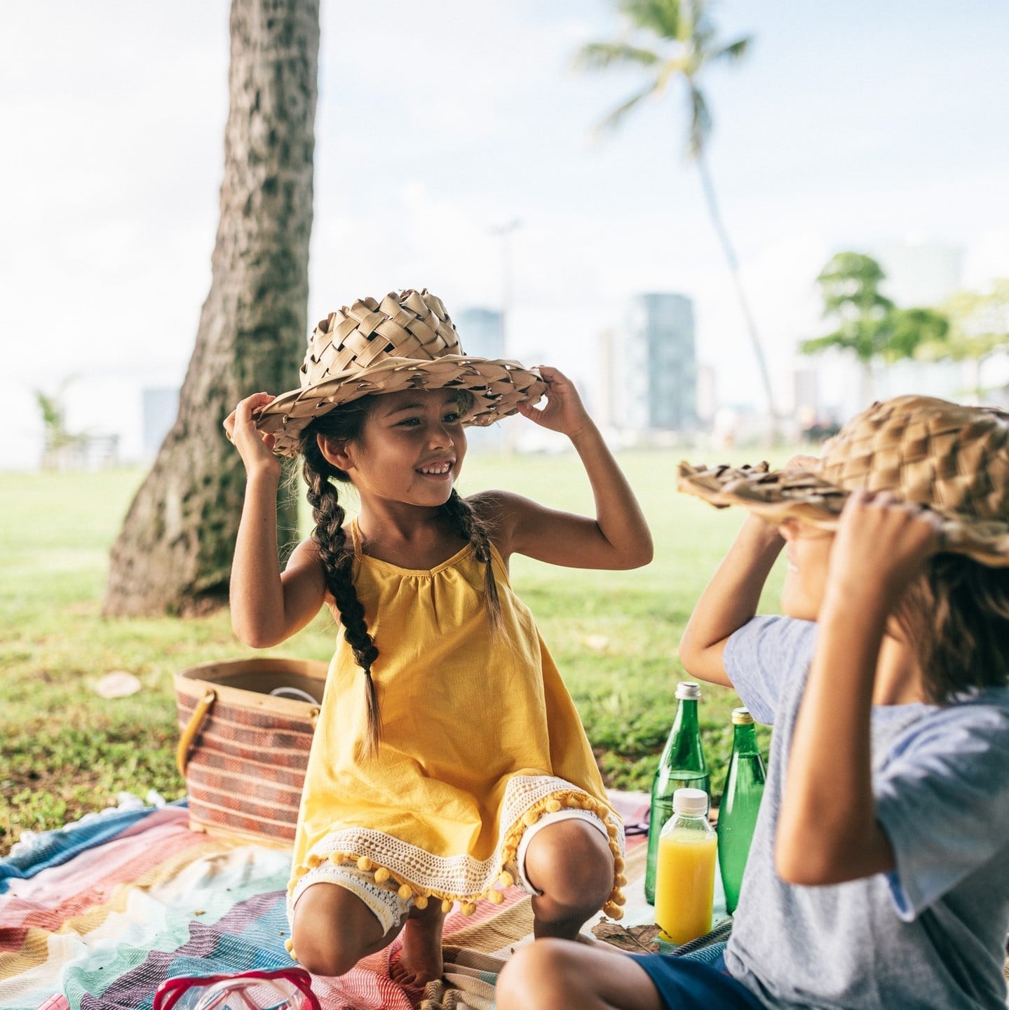At Ward Village, enjoy parks perfect for a relaxed picnic under the palm trees.