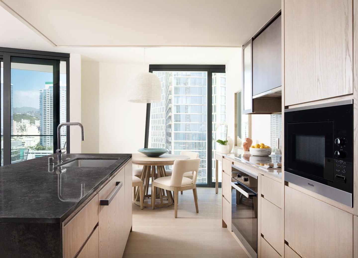 At Kōʻula, the kitchens are masterly crafted with custom designed wood cabinetry, natural stone countertops, a full height backsplash and Miele appliances. Visit www.koulawardvillage.com to schedule a tour and learn more about these move-in ready residences.