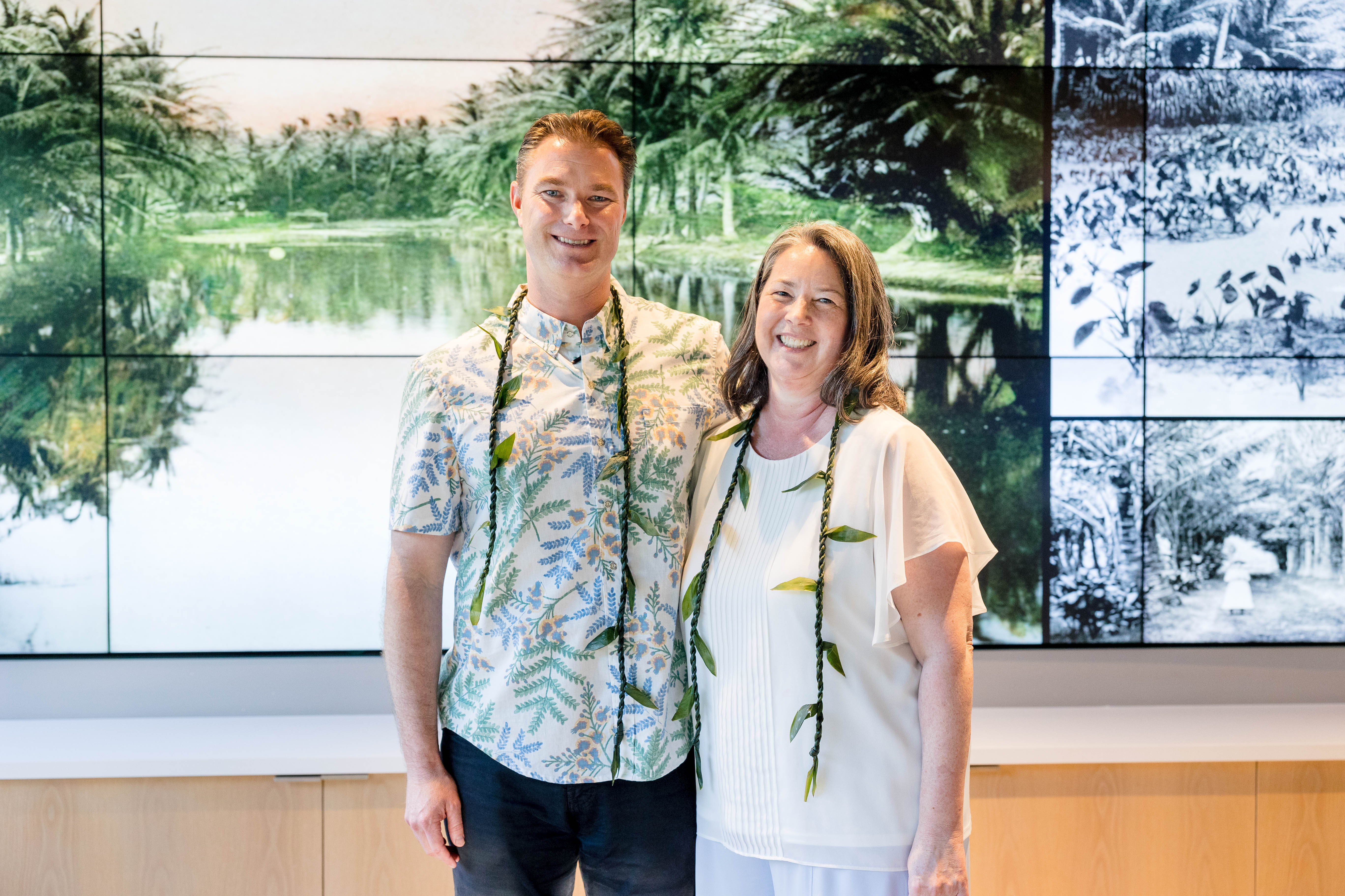 Man and Woman with leis in IBM building