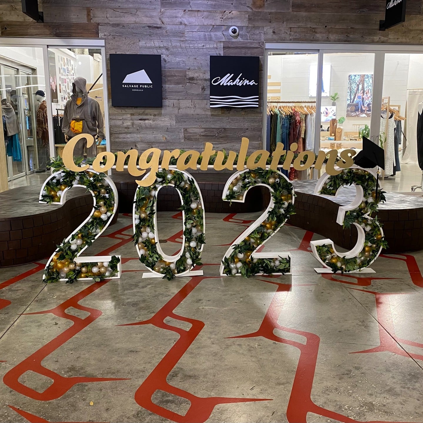 Congratulations to the Class of 2023! Snap a photo with family, friends, and classmates to commemorate your achievements at our Graduation Photo Wall, on display in South Shore Market now through June 17.