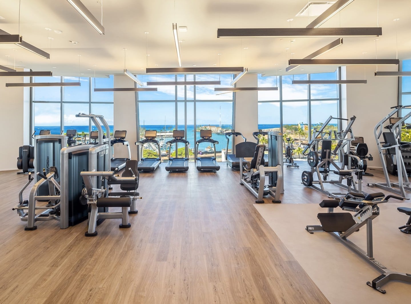 Discover Kōʻula's indoor fitness center, where your workout is framed by sweeping ocean views, while a dedicated outdoor fitness pavilion allows you to enjoy the trade winds. Learn more about Kōʻula's amenity spaces at the link in our bio.